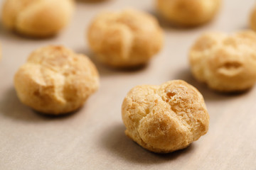 profiteroles on brown paper closeup