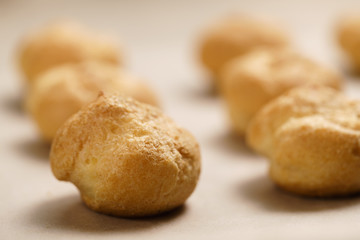 profiteroles on brown paper closeup