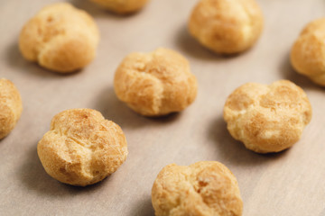 profiteroles on brown paper closeup