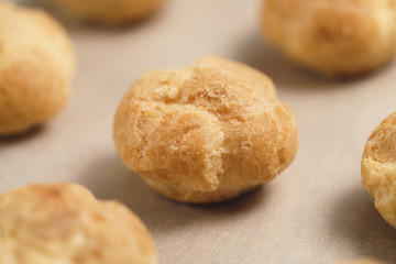 profiteroles on brown paper closeup