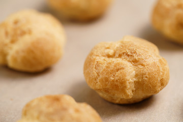 profiteroles on brown paper closeup