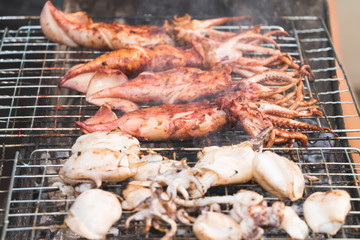 Squid grilled with smoke on selective focus