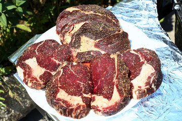 Closeup of a beef steak on the grill. Shallow depth of field