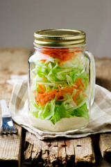 Fototapeta na wymiar cale slaw salad in the maison jar.