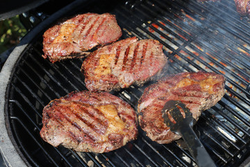BBQ grill steaks grilled meat on the flame