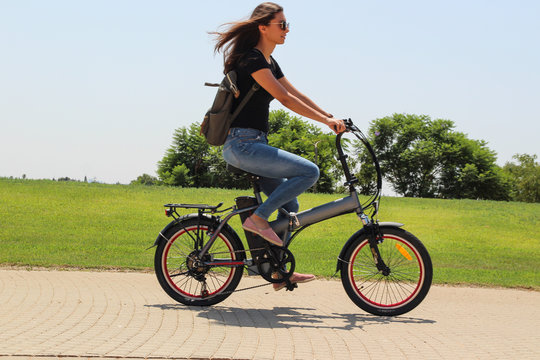 A women riding on electric e bike in the park