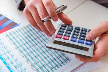 Finance analyst looking and financial reports
