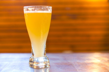 Glass of light beer in a pub