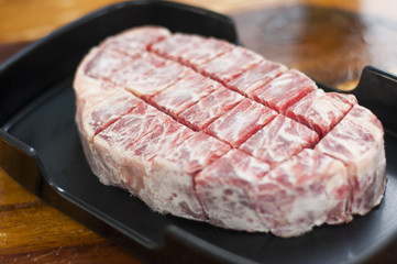 Close up freeze sirloin beef on dish prepare before grill steak