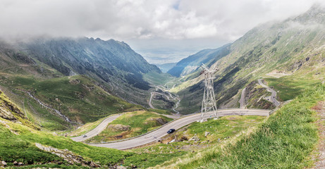 Fototapeta na wymiar Panoramic view of the most famous and dangerous road in Europe is a Transfagarasan road in Carpathian mountains, Romania