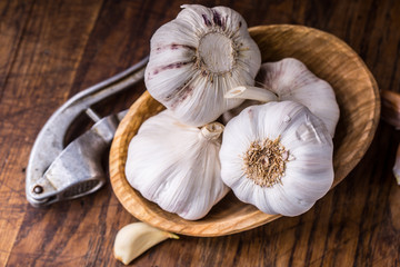 Garlic. Garlic Cloves and Garlic Bulb in vintage wooden bowl