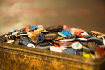 The old buttons. Buttons in an old metal box.