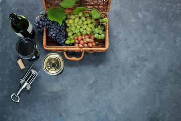 Glasses with white and red wine on black background