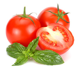 tomato with basil leaf isolated on white background