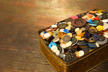 The old buttons. Buttons in an old metal box.