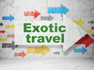 Travel concept: arrow with Exotic Travel on grunge wall background