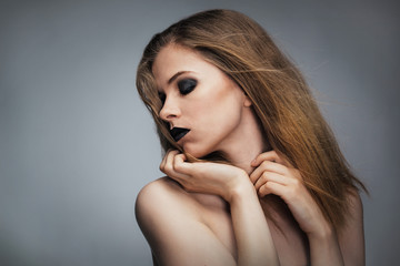 Naklejka premium Young woman with bright make-up