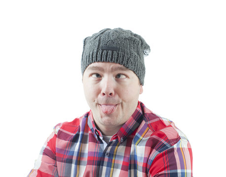 Caucasian man looking weird and funny with a hat on. The man isolated on white.