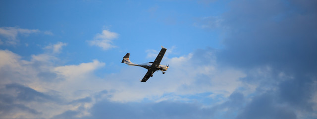 Small plane on blue sky background
