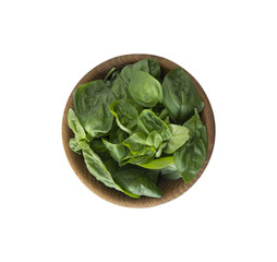 Fresh basil leaves in wooden bowl isolated on white background. Top view. Basil with copy space for text.
