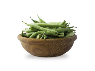 Fresh green beans in wooden bowl isolated on white background. Green beans with copy space for text.