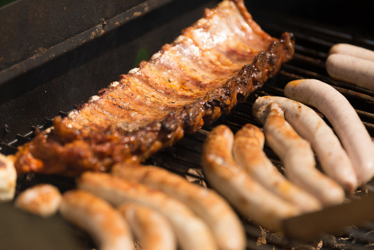 Spare Ribs and Sausage on Barbecue Grill