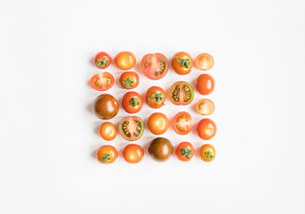 Cherry tomatoes pattern in a square on white background. Flat lay, top view