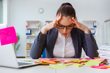 Businesswoman with conflicting priorities in office