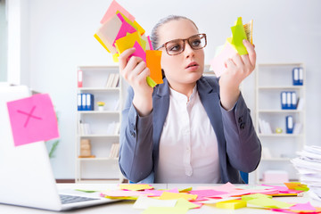 Businesswoman with conflicting priorities in office