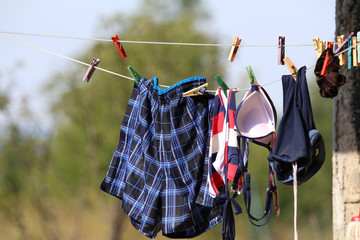 Bathing clothes dry on the leash / Bathing clothes are dried on a rope