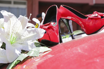 wedding bouquet and red bride shoes 
