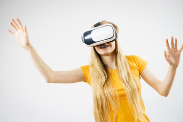 Girl wearing virtual reality goggles.