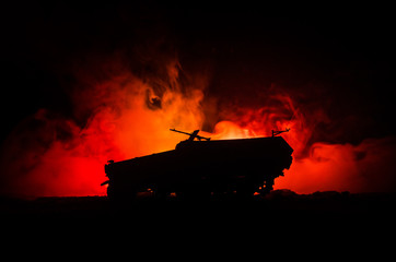War Concept. Military silhouettes fighting scene on war fog sky background, German tank in action...