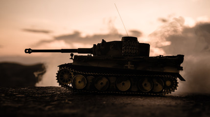 War Concept. Military silhouettes fighting scene on war fog sky background, World War German Tanks...