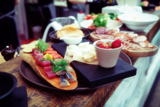 Platter of food on restaurant counter, toned