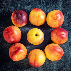 Fresh ripe nectarine peach fruit, crop rustic background. Top view
