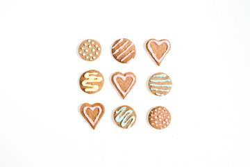Colorful hand made cookies on white background. Flat lay, top view.