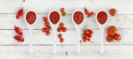Poster tomato sauce spoon with tomatoes and basil Isolated on wooden white background © amedeoemaja