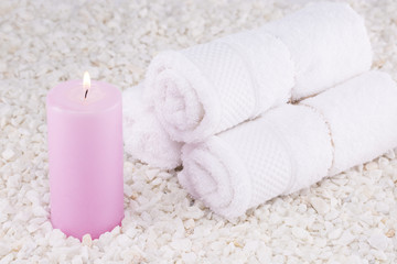 Obraz na płótnie Canvas Spa. Still life. Towels rolled up, a pink candle