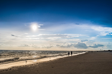 Sunset Walking down the beach 