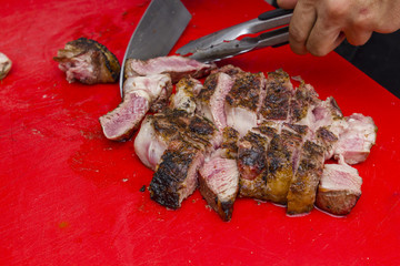grilled steak cut with knife