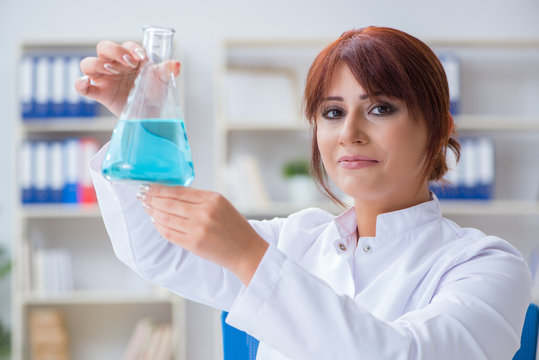 Female scientist researcher conducting an experiment in a labora