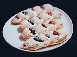 French meringue cookies on the white plate.