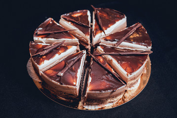 Chocolate cake on dark background.