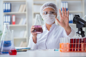 Female scientist researcher conducting an experiment in a labora