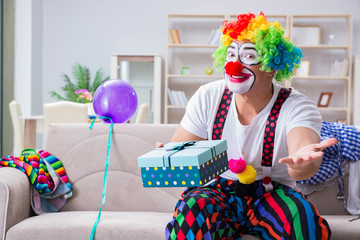 Drunk clown celebrating having a party at home