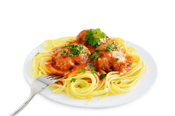Spaghetti pasta with meatballs and tomato sauce in plate isolated