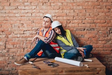 Happy couple making repairs to their home.