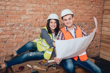 Happy couple making repairs to their home.