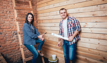 Happy couple making repairs to their home.